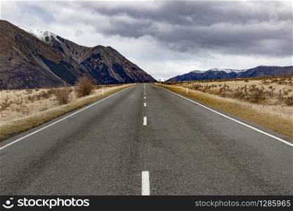 straight highway in arthur&rsquo;s pass national park one of most popular traveling destination in new zealand