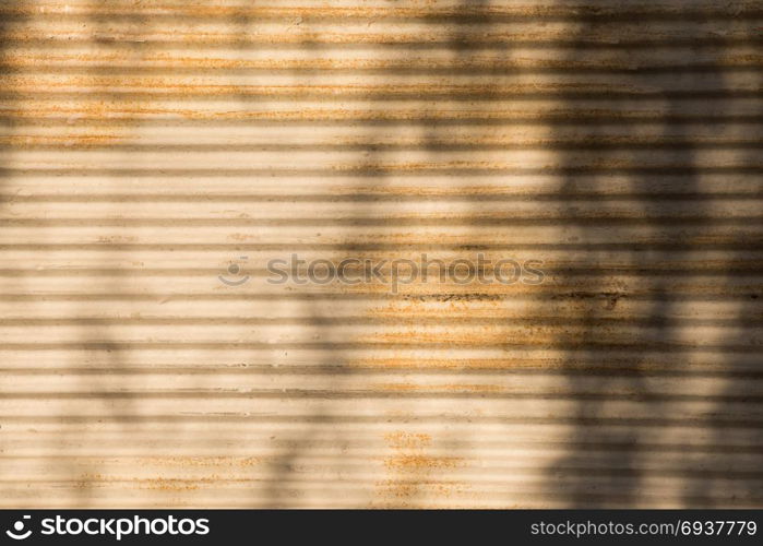 Straight lines on a shop front shutter as a metal background