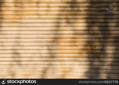 Straight lines on a shop front shutter as a metal background