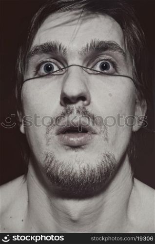 Strange portrait of a young man close up&#xA;