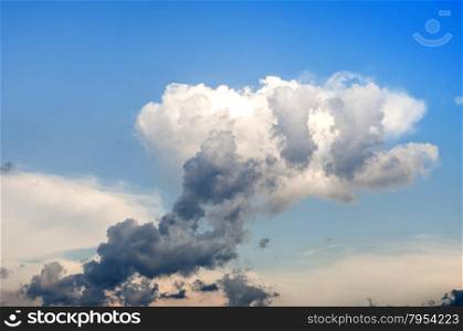 Strangely shaped cloud on blue sky background