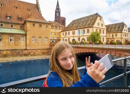Strasbourg city kid selfie photo in Alsace France. Strasbourg city kid girl selfie tourist photo in Alsace France