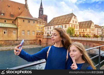 Strasbourg city kids selfie photo in Alsace France. Strasbourg city kids girls selfie tourist photo in Alsace France