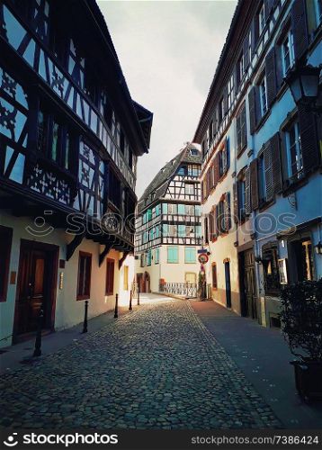 Strasbourg narrow streets of the old city with idyllic half timbered facades of medieval buildings. Beautiful architecture Petit France district, Alsace.