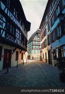Strasbourg narrow streets of the old city with idyllic half timbered facades of medieval buildings. Beautiful architecture Petit France district, Alsace.