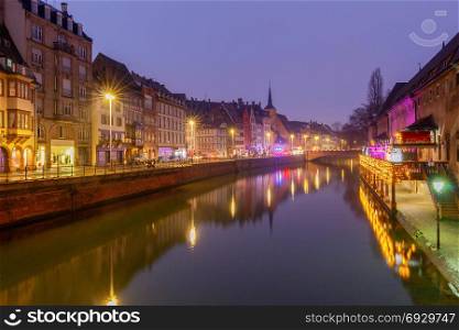 Strasbourg. Petite France district in the old city.. Half-timbered house on the canal at night in Strasbourg. Alsace.