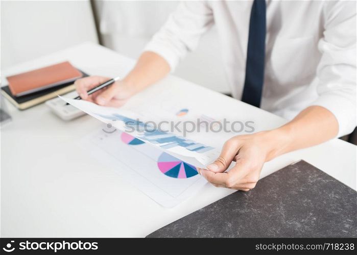 strategy analysis concept, Businessman working financial Manager Researching Process accounting calculate analyse market graph data stock information review on the table in office.