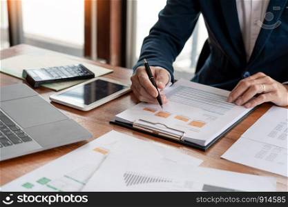 strategy analysis concept, Businessman working financial Manager Researching Process accounting calculate analyse market graph data stock information review on the table in office