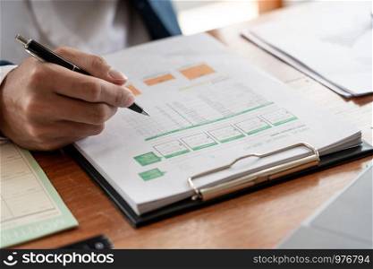 strategy analysis concept, Businessman working financial Manager Researching Process accounting calculate analyse market graph data stock information review on the table in office