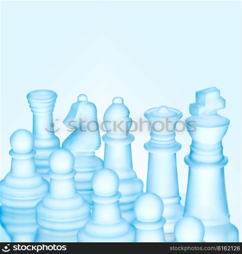 Strategy and tactics concept; icy frosted chess figures standing in a row ready for game