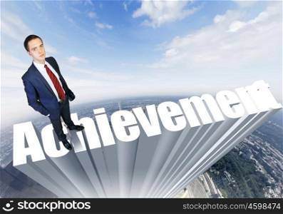 strategy. Businessman in suit standing on the word Achievement