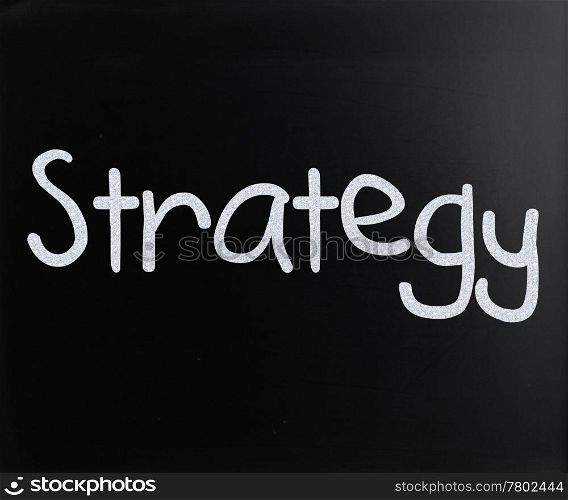 ""Strategy" handwritten with white chalk on a blackboard"