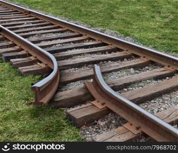 Strategy obstruction challenges with a train track that is broken as a business concept of a road block and finding solutions to obstacles that are dangerous and challenging as journey on a strategic goal.