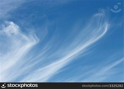 Stratospheric elongated clouds against blue sky