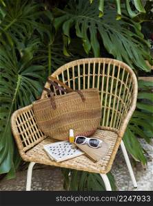 straw chair travel items arrangement