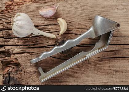Straw chopper garlic on old wooden boards