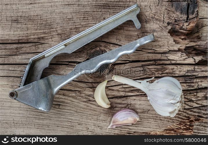 Straw chopper garlic on old wooden boards