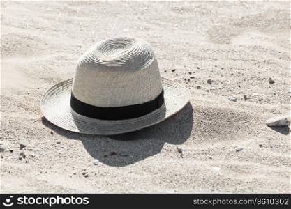 straw hat on the sandy beach