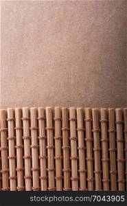 Straw mat and brown background for background usage
