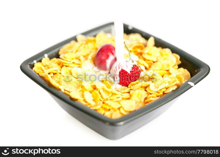 strawberries and cherries in the bowl of Cornflakes with milk isolated on white