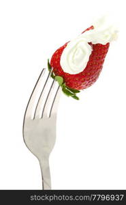 strawberries and cream on fork isolated on white