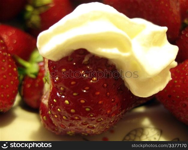Strawberries and cream on the plate