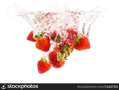 Strawberries falling into water causing bubbles all around it. Healthy food concept. Underwater, splash photography.. Strawberries falling into water causing bubbles all around it. Healthy food concept