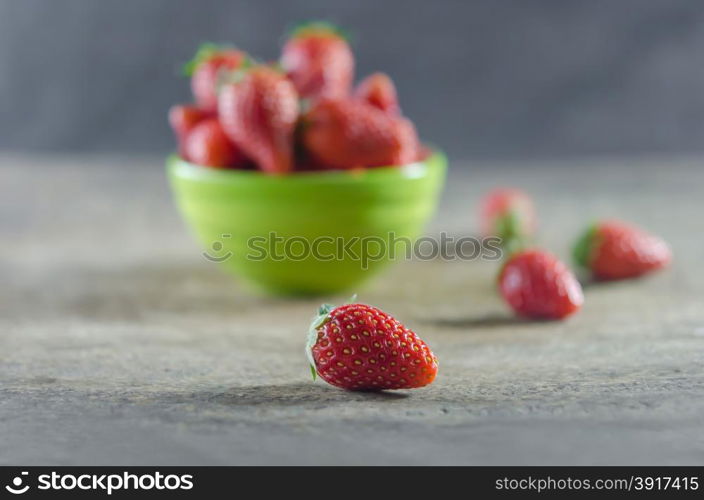 strawberries. Green bowl filled with fresh ripe red strawberries