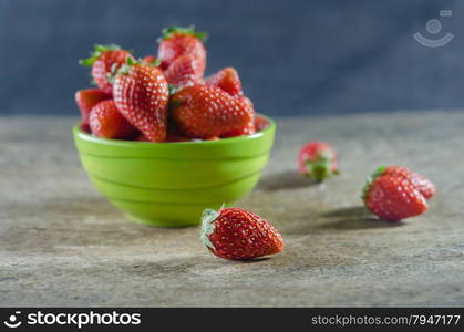 strawberries. Green bowl filled with fresh ripe red strawberries