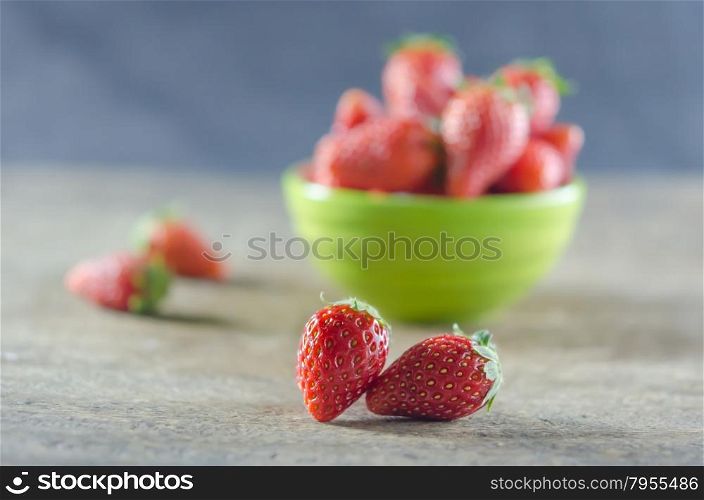 strawberries. Green bowl filled with fresh ripe red strawberries