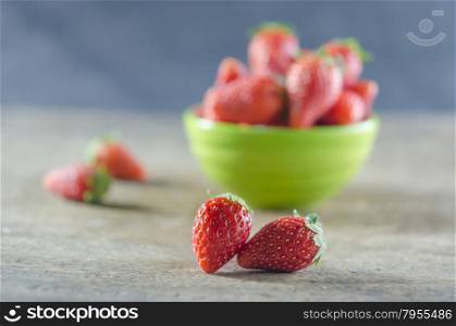 strawberries. Green bowl filled with fresh ripe red strawberries