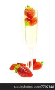 strawberries in a glass of champagne isolated on white