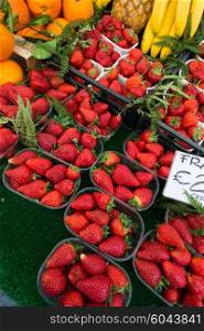 Strawberries in boxes as healthy food on sale