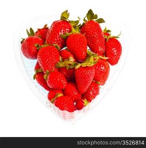 strawberries in heart-shaped pack isolated on white background