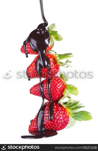 strawberries in pouring of chocolate isolated on white background
