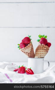 Strawberries in waffle cones