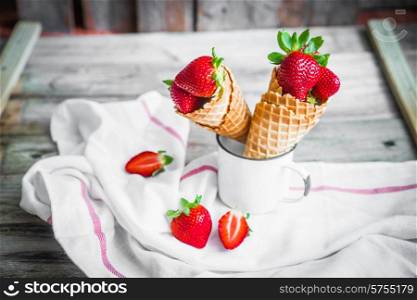 Strawberries in waffle cones