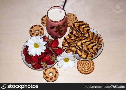 Strawberries milkshake and cookies and flower of Chrysanthemum