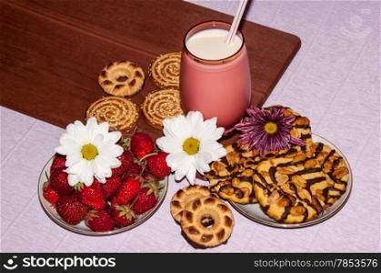 Strawberries milkshake and cookies and flower of Chrysanthemum