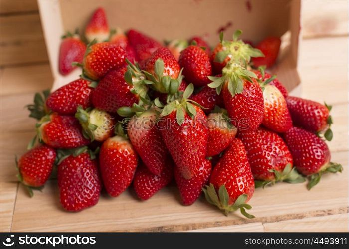 strawberries on a wooden table, studio picture