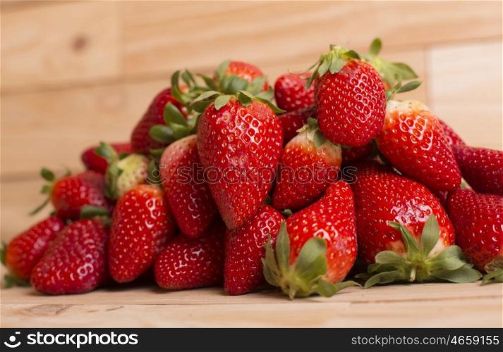 strawberries on a wooden table, studio picture
