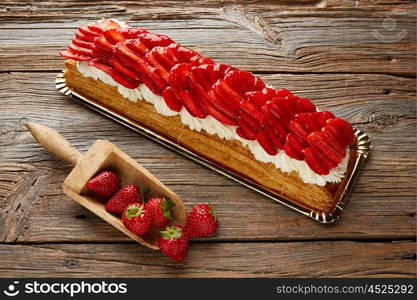 Strawberries puff pastry pie on wooden table