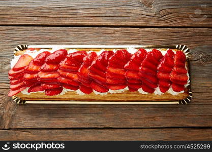 Strawberries puff pastry pie on wooden table