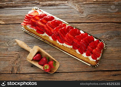 Strawberries puff pastry pie on wooden table