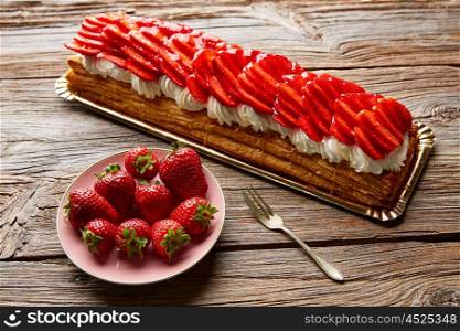 Strawberries puff pastry pie on wooden table