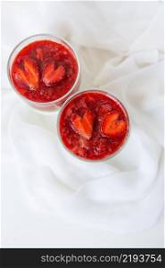 Strawberry and chia seed pudding in a cup for breakfast and strawberries in the shape of a heart. February 14, St. Valentine&rsquo;s Day. Strawberry and chia seed pudding in a cup for breakfast and strawberries in the shape of a heart. February 14, St. Valentine&rsquo;s Day.