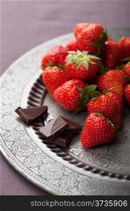strawberry and chocolate on vintage plate