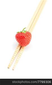 strawberry and chopsticks isolated on white