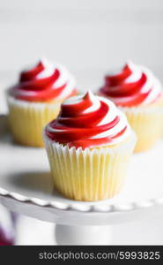 Strawberry and vanilla cupcakes on white background