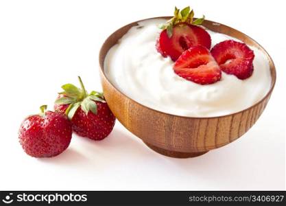 strawberry and yogurt in a wooden bowl on withe background